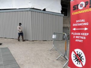 Photo of man walking in mask
