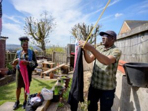 Photo of couple hanging out washing