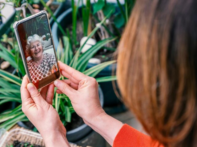 Photo of women video calling a relative