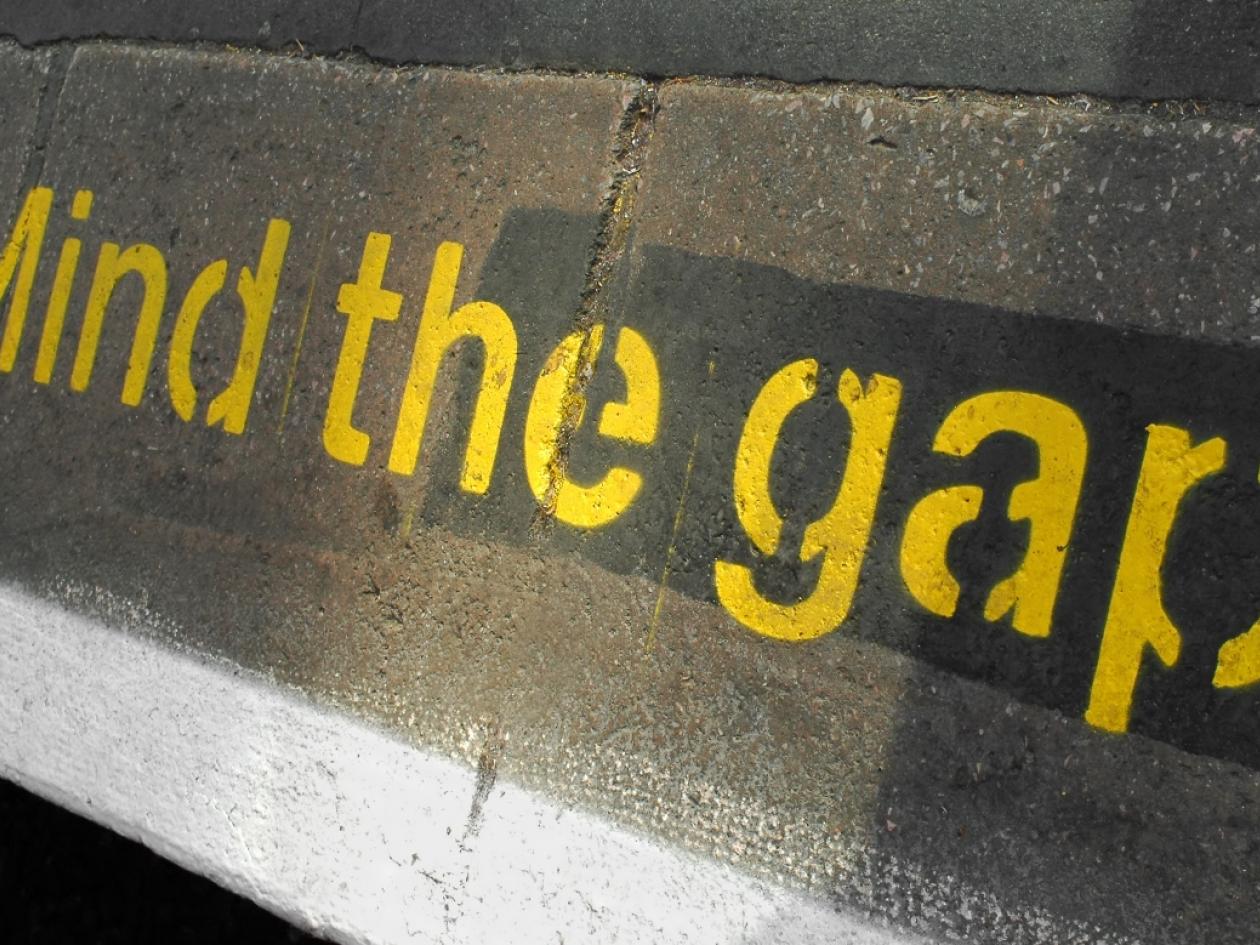 the words 'mind the gap' at a tube station