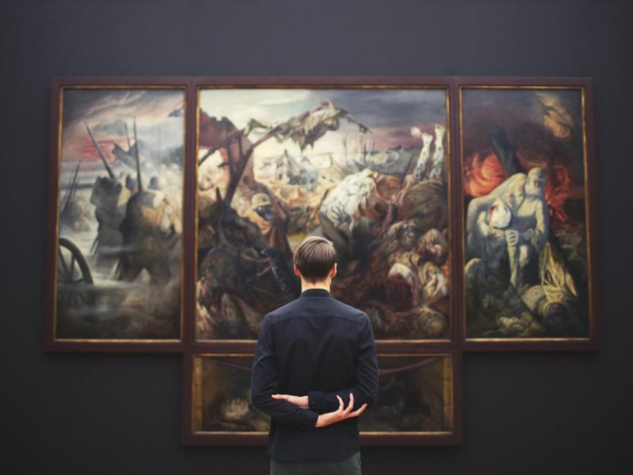 Man standing in front of an artwork