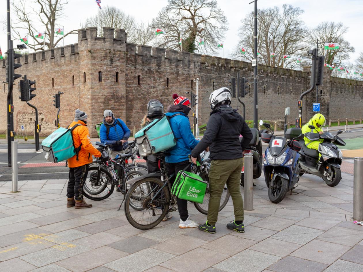 a group of delivery riders on bikes