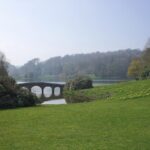 Stourhead - the garden of a National Trust property showing a lawn and a lake