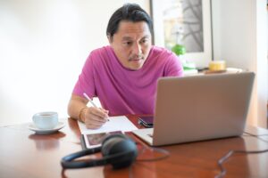 Photo of man working from home