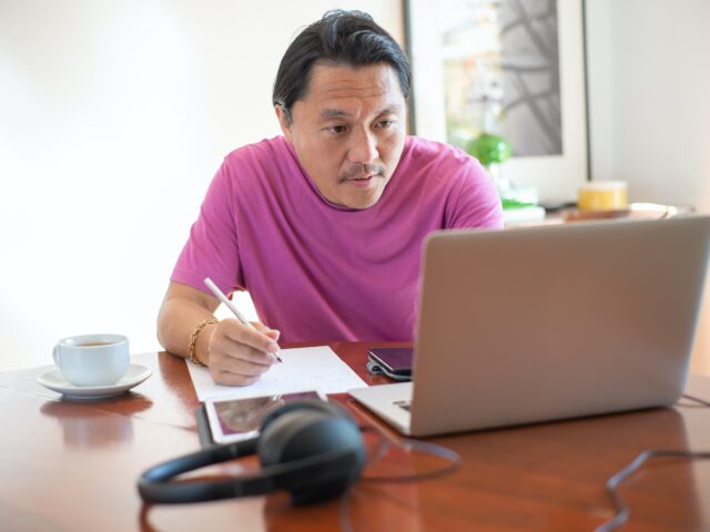 Photo of man working from home
