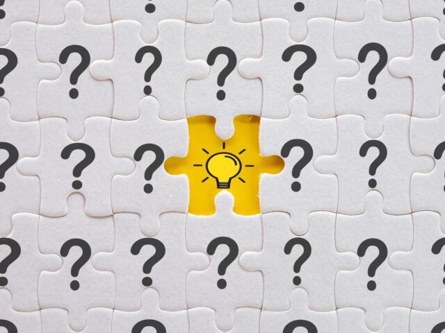 Phot of question marks and a light bulb