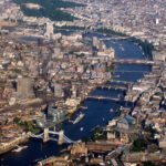 Aerial view of London, showing Thames and buildings either side, Tower Bridge at bottom left