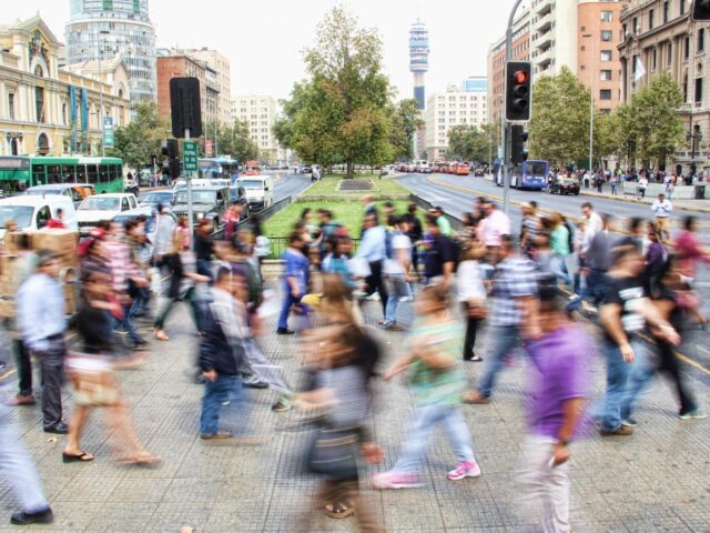 Image of crowd walking through public space by Mauro Mora for Unsplash