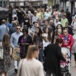 A group of people in a busy high street