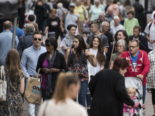 A group of people in a busy high street