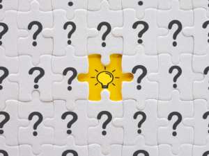 Design of question marks with a lightbulb in the middle.