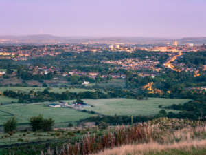 Photo of a UK town and countryside around it.